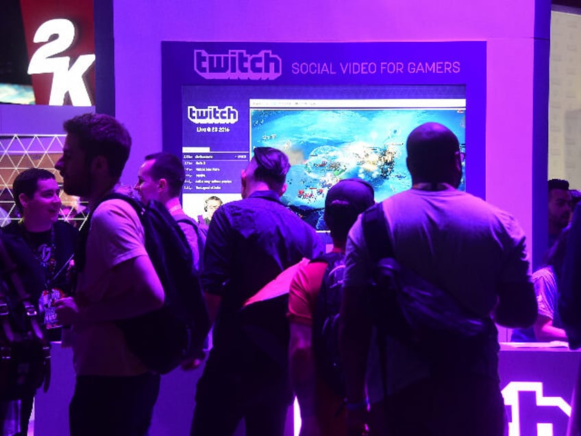 People wait in line at booth for Twitch, the official Livestream Partner of E3 during the 2016 Electronic Entertainment Expo (E3) annual video game conference and show on June 14, 2016 in Los Angeles, California. / AFP / FREDERIC J. BROWN (Photo credit should read FREDERIC J. BROWN/AFP via Getty …