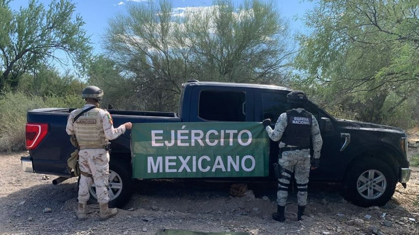 National Guard soldiers investigating scene