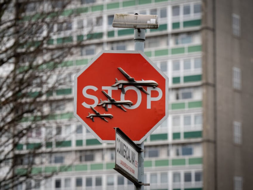 Banksy has unveiled a new piece of art work at the intersection of Southampton Way and Commercial Way in Peckham, south east London, which shows what looks like three drones on a traffic stop sign. Picture date: Friday December 22, 2023. (Photo by Aaron Chown/PA Images via Getty Images)