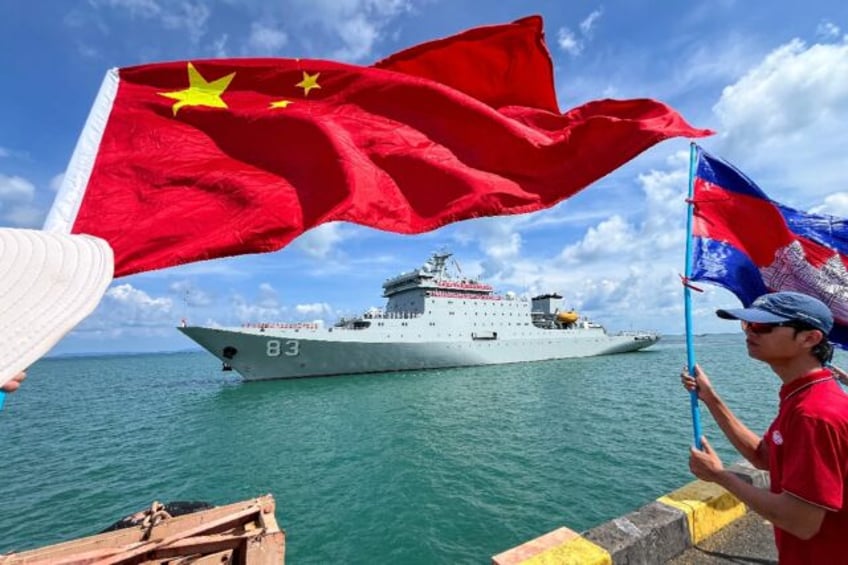 The Chinese training ship Qijiguang (pictured) and amphibious warfare ship Jinggangshan ar