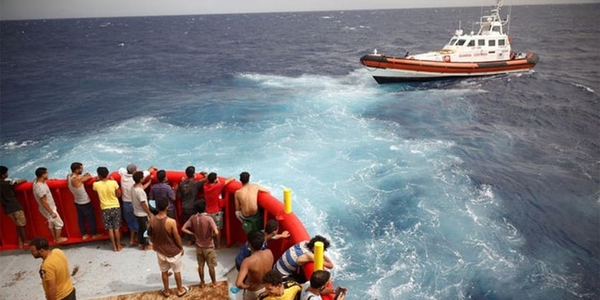 two dead as italian crews rescue dozens of migrants from multiple shipwrecks off countrys southern coast