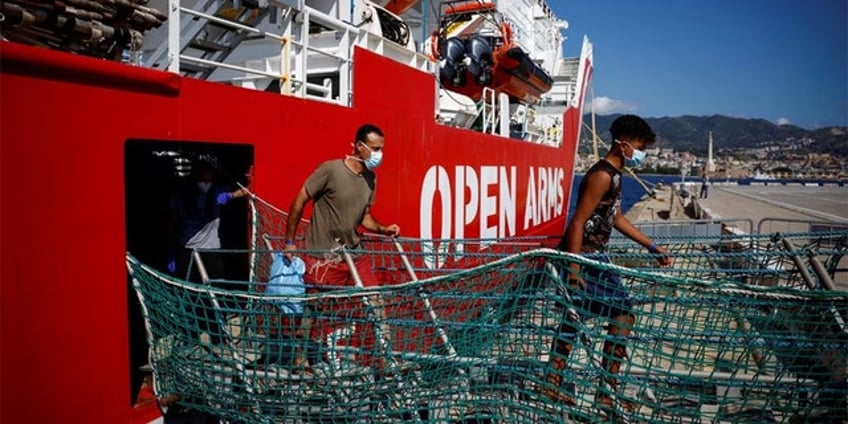 two dead as italian crews rescue dozens of migrants from multiple shipwrecks off countrys southern coast