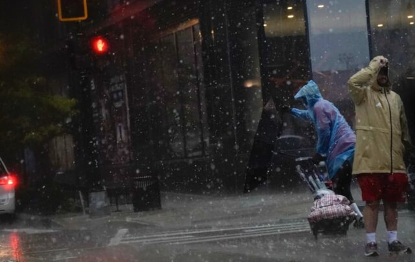 two dead thousands without power as storms batter eastern us