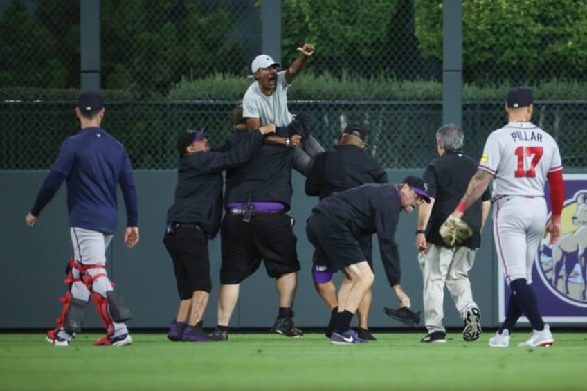 two fans arrested after on field incident with braves acuna