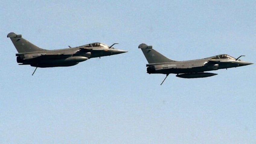 Two French Rafale fighter jets fly during a military exercise with Indian navy off the coa