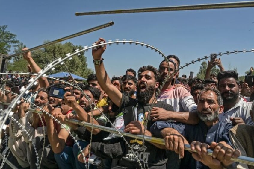 Kashmiris attend an election rally held by Sheikh Abdul Rashid also known as "Engineer" Ra