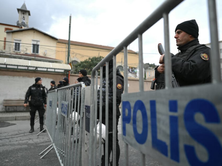 Turkish anti riot police officers block the street of Santa Maria church after an attack in Istanbul, on January 28, 2024. Two assailants launched an armed attack on an Italian church in Istanbul during a religious ceremony on January 28, 2024, leaving one person dead, Turkey's interior minister said. (Photo …