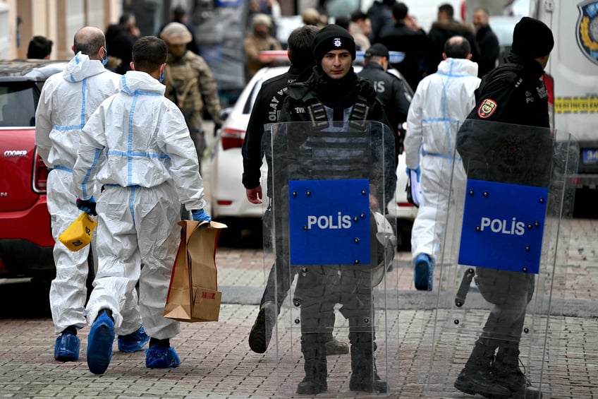 Turkish forensic police officers hold boxes as they walk in front of Santa Maria church after a attack, in Istanbul, on January 28, 2024. Two assailants launched an armed attack on an Italian church in Istanbul during a religious ceremony on January 28, 2024, leaving one person dead, Turkey's interior minister said. (Photo by OZAN KOSE / AFP) (Photo by OZAN KOSE/Afp/AFP via Getty Images)