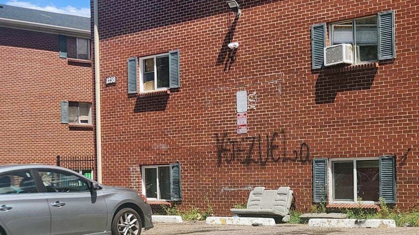 Occupied apartment building with "Venezuela" graffiti