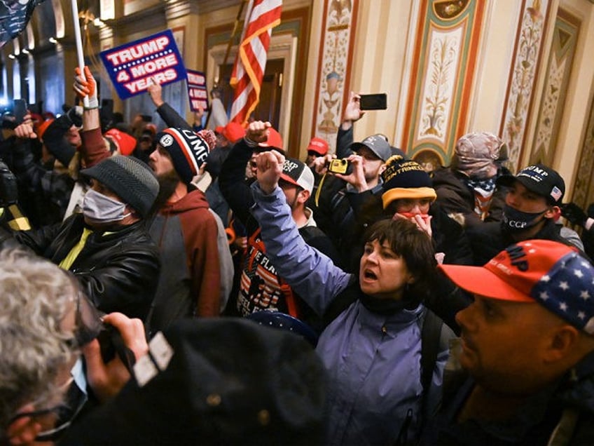 two proud boys sentenced to 10 18 years prison for role in capitol riot