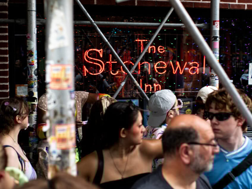 Attendees outside the Stonewall Inn during the NYC Pride March in New York, US, on Sunday,