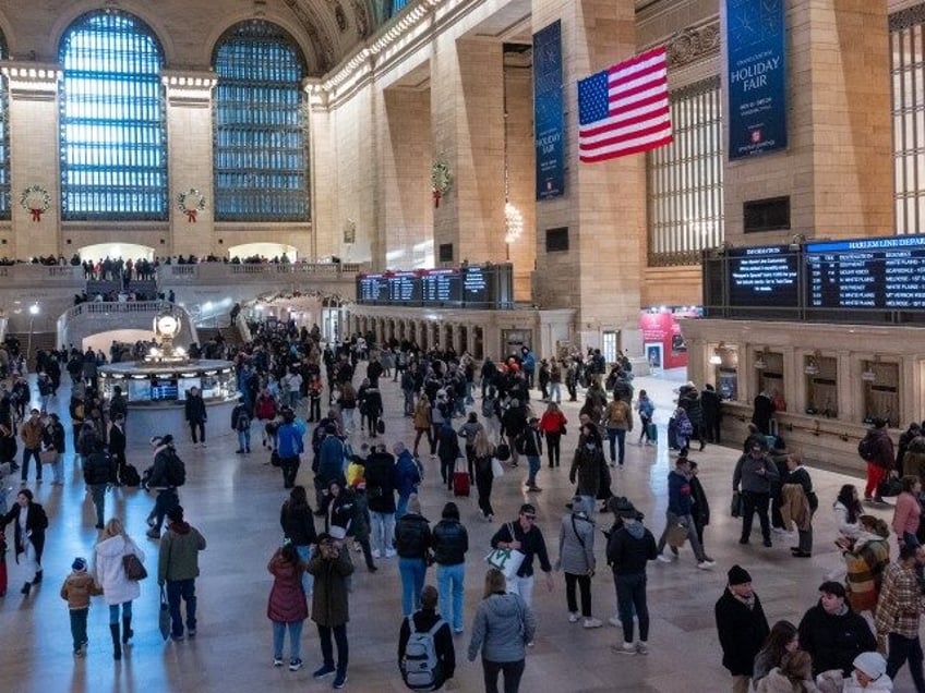 People walk through Grand Central Terminal in midtown Manhattan only days before the Christmas holiday on December 22, 2023, in New York City. New York City has witnessed an influx of tourists and others coming to the city this holiday season to shop, eat and take in a show. The …