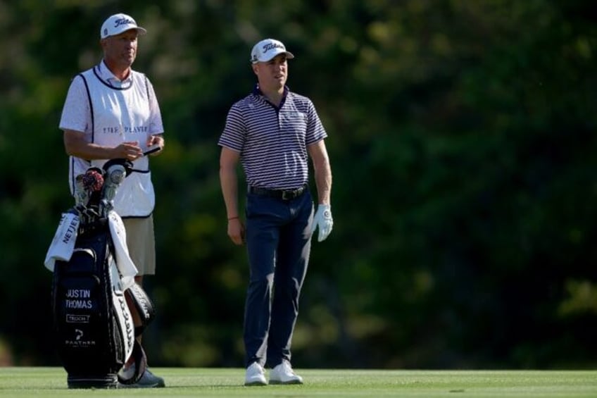 Two-time major winner Justin Thomas (R) announced he has split with veteran caddie Jim "Bo