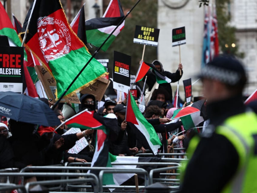 two women charged with terror offences over paraglider images at pro palestine protest in london