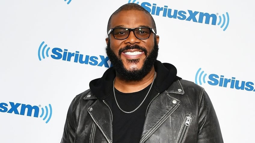 Tyler Perry in glasses on a red carpet