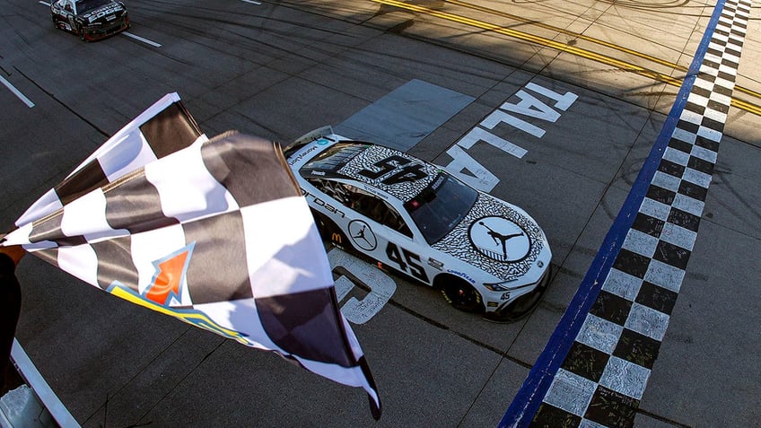 Tyler Reddick crosses the finish line