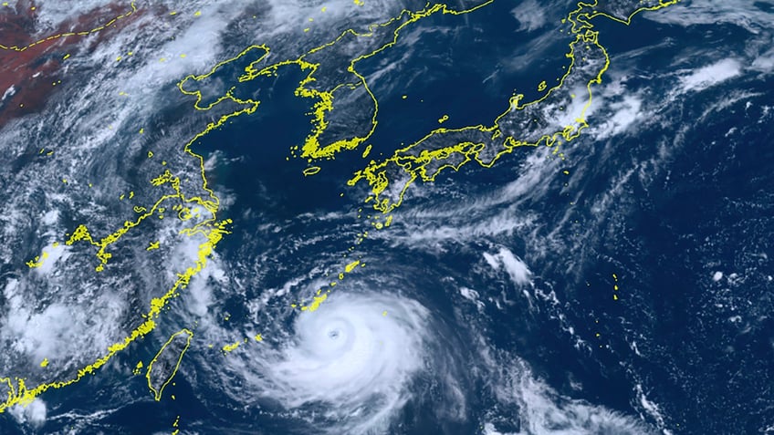 typhoon khanun lashes okinawa with strong winds high waves