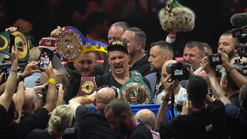 Oleksandr Usyk celebrates