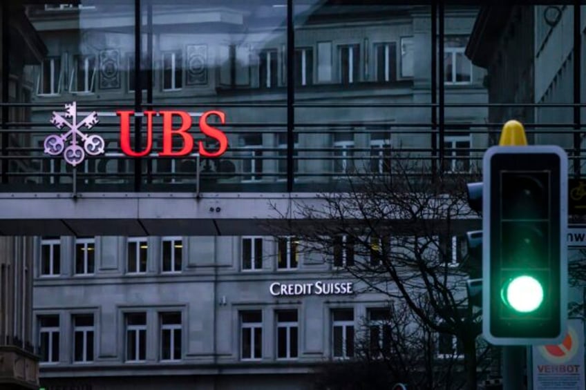 ubs reports huge 2q profit skewed by credit suisse takeover foresees 10b in cost cuts