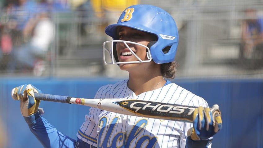 Maya Brady smiles with helmet on