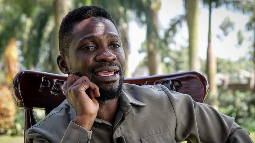 ugandan opposition figure bobi wine briefly detained upon return claims house arrest