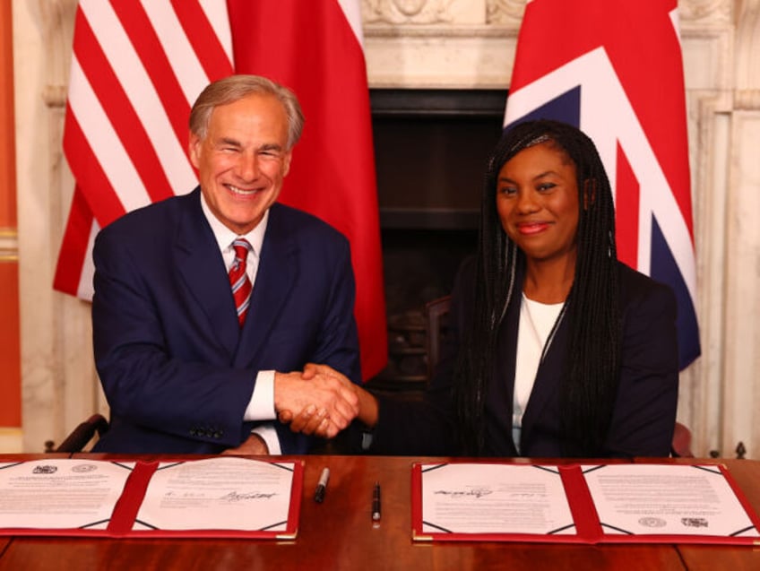 LONDON, ENGLAND - MARCH 13: Kemi Badenoch, the UK Business and Trade Secretary (R) and Tex