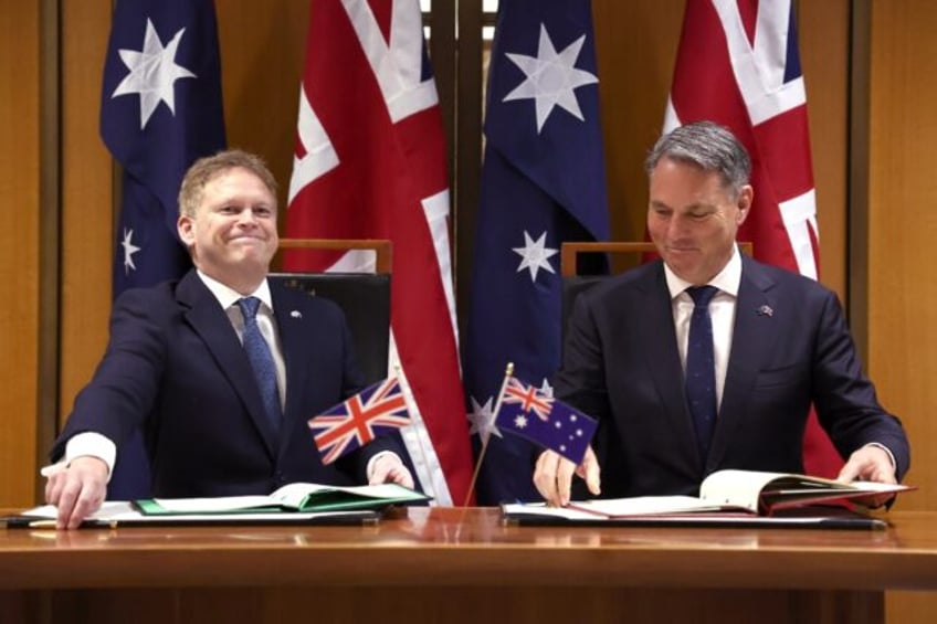 Australia's Defence Minister Richard Marles (R) and British counterpart Grant Shapps take