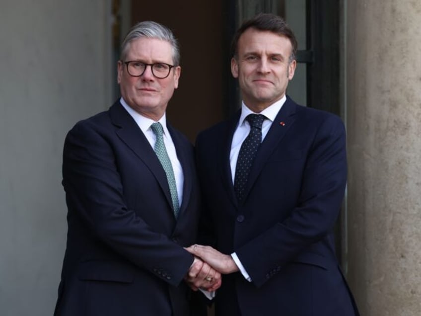 PARIS, FRANCE - FEBRUARY 17: French President Emmanuel Macron welcomes British Prime Minis