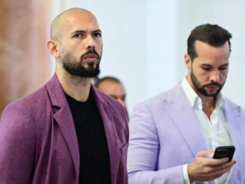 Andrew Tate (L) and his brother Tristan Tate are pictured inside The Court of Appeal in Bu