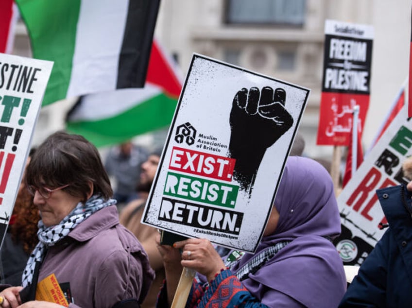 LONDON, UNITED KINGDOM - 2023/05/13: Protestors hold placards during the National Demonstr