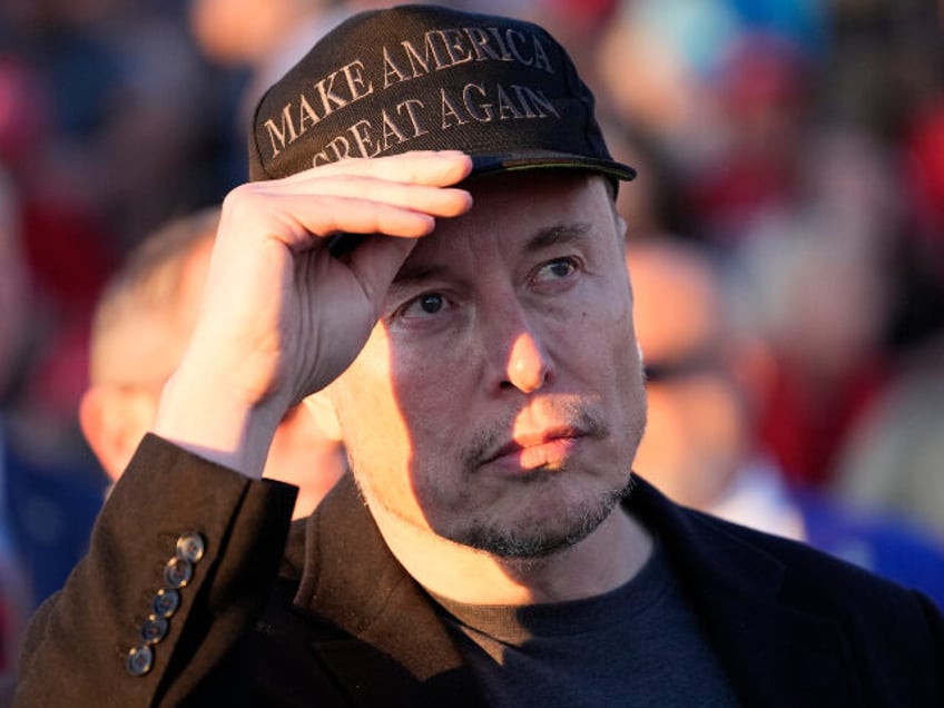 Tesla and SpaceX CEO Elon Musk listens as Republican presidential nominee former President