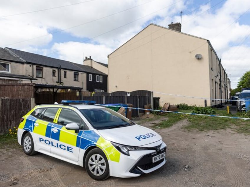 ROCHDALE, ENGLAND - MAY 04: Police forensic officers search a house on May 04, 2025 in Roc