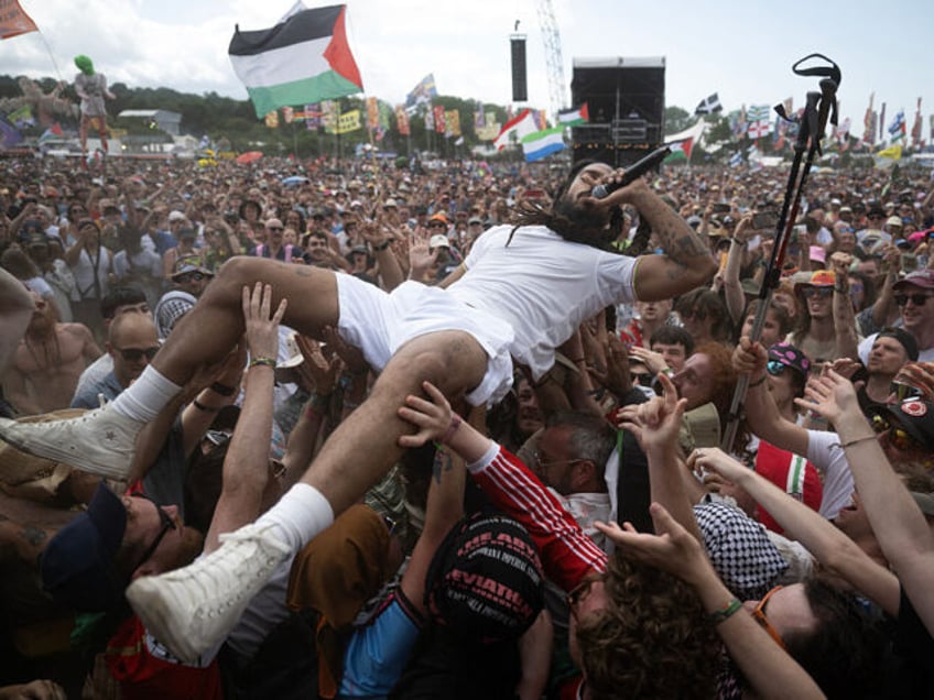 Bobby Vylan of British duo Bob Vylan crowd surfing while performing on the West Holts Stag