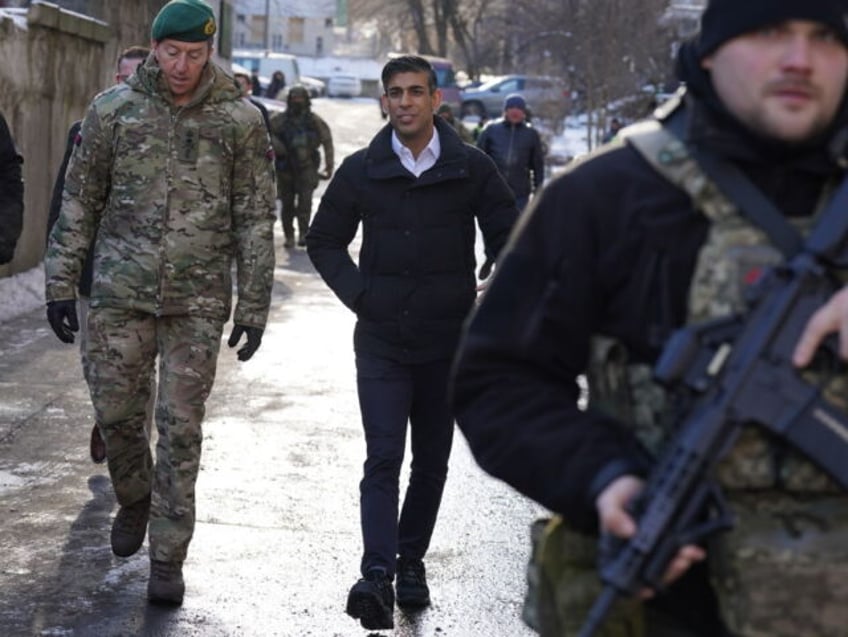 Prime Minister Rishi Sunak and Vice Chief of the Defence Staff, Major General Gwyn Jenkins (left), are shown damaged buildings in Kyiv, Ukraine, ahead of meeting with President Volodymyr Zelensky to announce a major new package of military aid to Ukraine. Picture date: Friday January 12, 2024. (Photo by Stefan …