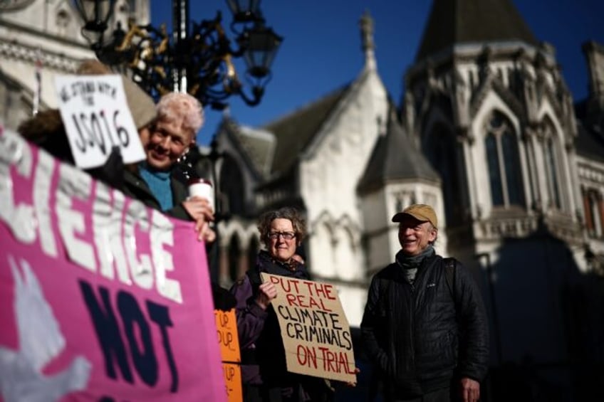 Protesters outside the Royal Courts of Justice in central London to support 16 Just Stop O