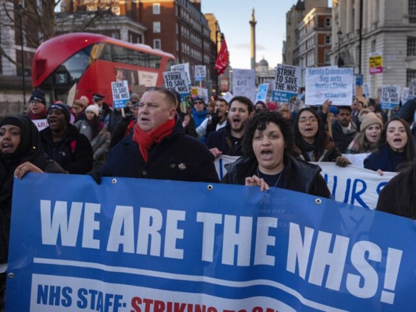LONDON, ENGLAND - JANUARY 18: Nursing staff and supporters march down Whitehall to Downing