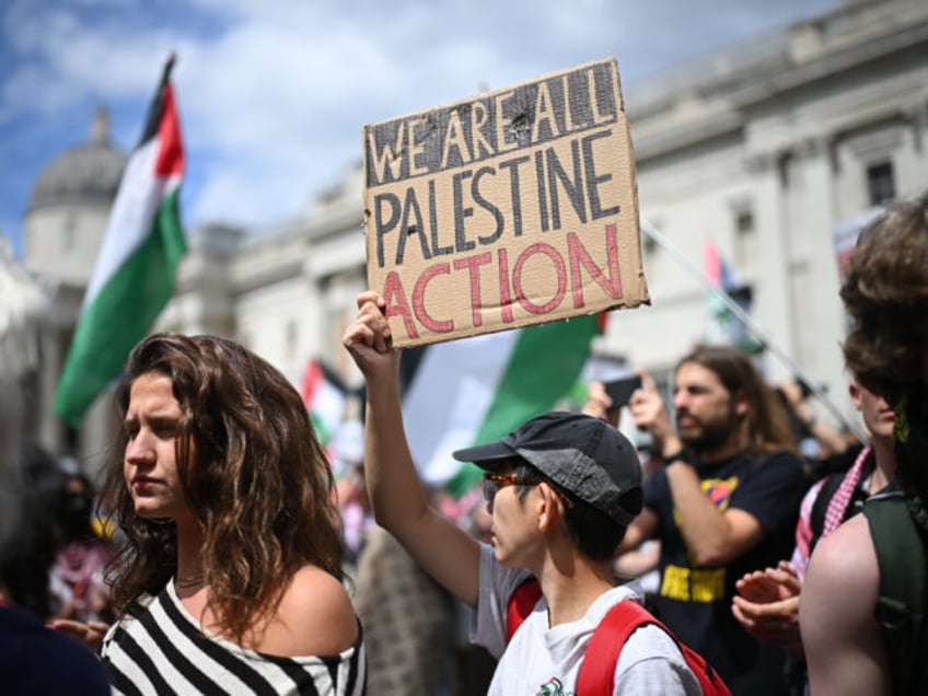 LONDON, ENGLAND - JUNE 23: A protester holds a sign reading 'We are all Palestine Action'