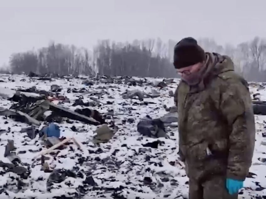 BELGOROD, RUSSIA - JANUARY 25: (----EDITORIAL USE ONLY - MANDATORY CREDIT - 'RUSSIAN INVESTIGATIVE COMMITTEE / HANDOUT' - NO MARKETING NO ADVERTISING CAMPAIGNS - DISTRIBUTED AS A SERVICE TO CLIENTS----) A screen grab captured from a video shows officials inspect the site after Russian IL-76 military transport plane crashed in …