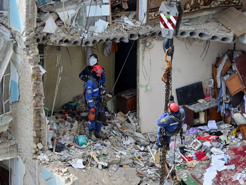 KYIV, UKRAINE - 2025/06/23: Ukrainian rescuers conduct a search operation in a residential