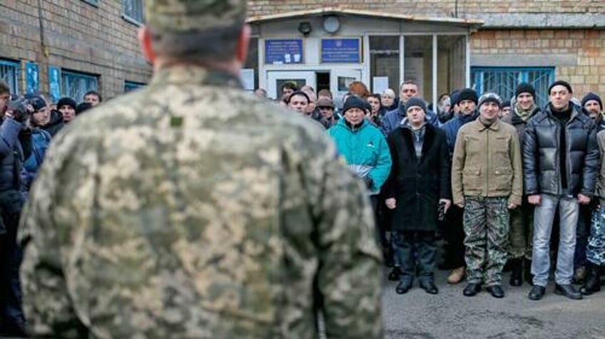 ukraine enforces desperate conscription laws as russian troops close in on kharkiv