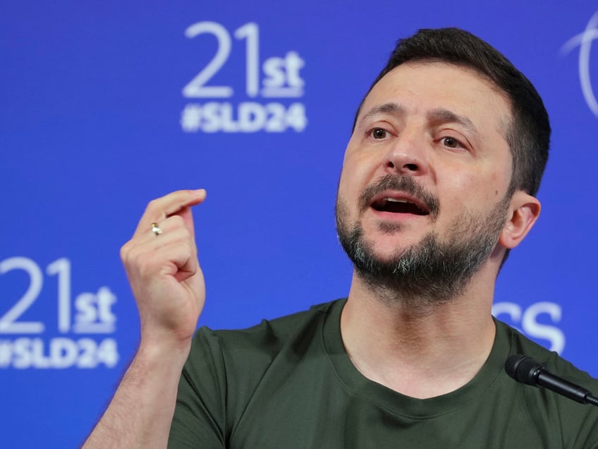 Ukraine's President Volodymyr Zelenskyy speaks during a press conference after the 21st Shangri-La Dialogue summit at the Shangri-La Hotel in Singapore, Sunday, June 2, 2024. Zelenskyy urged a group of top defense officials at Asia’s premier security conference on Sunday to attend an upcoming peace summit, saying Ukraine was ready to hear “various proposals and thoughts” on ending the war with Russia.(AP Photo/Vincent Thian)