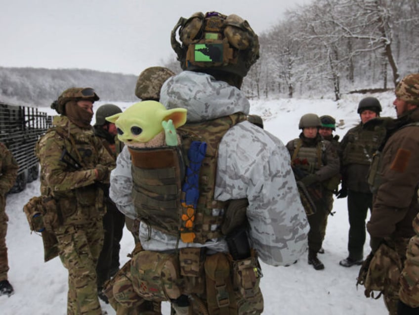 In Kharkiv Region, Ukraine, on December 14, 2023, a serviceman is carrying a Baby Yoda toy in the pocket at the back of his bulletproof vest while senior sergeants from the units of the Eastern Operational and Territorial Command of the National Guard of Ukraine are receiving special training in …