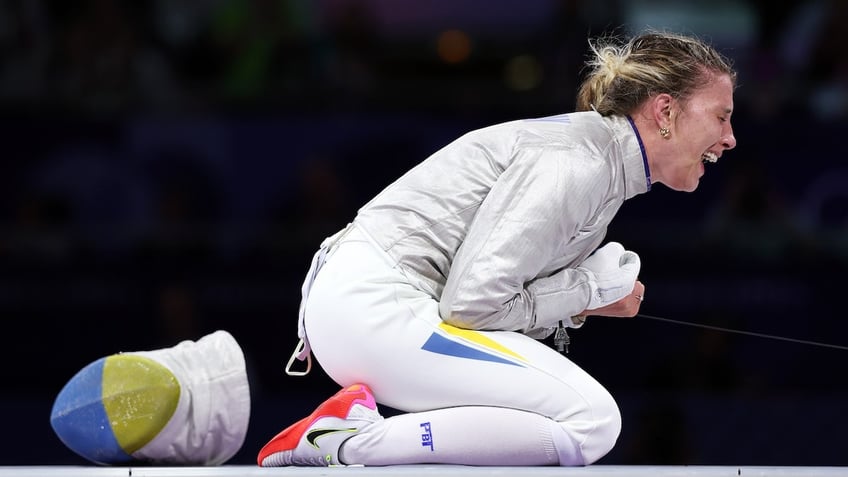 Olga Kharlan celebrates winning the Fencing Women's Sabre Individual Bronze Medal 