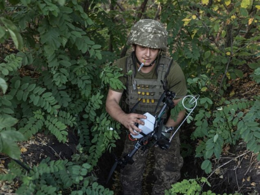 LUHANSK, UKRAINE - AUGUST 25: Ukrainian soldiers prepare FPV drones as military mobility o