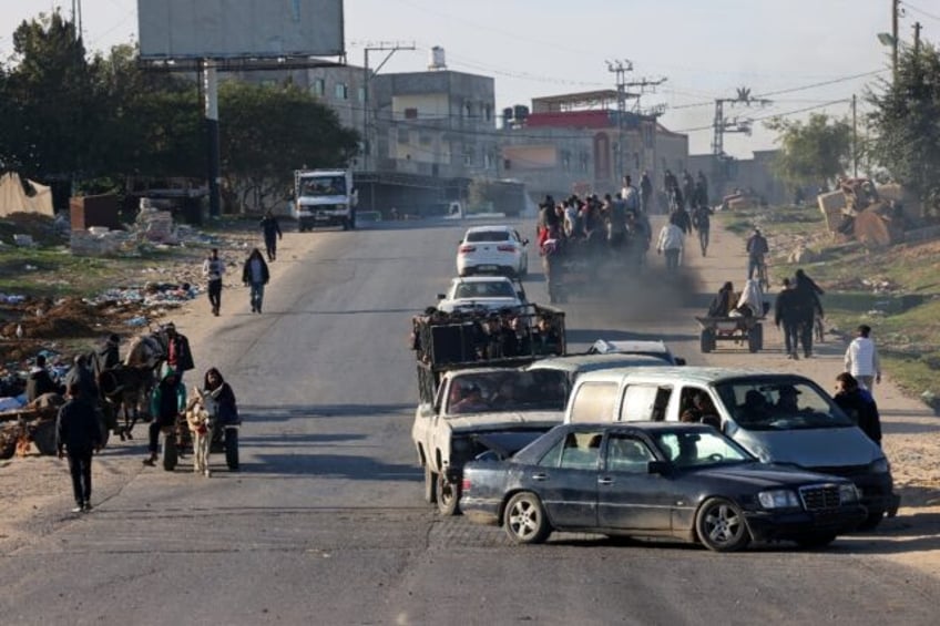 Palestinians flee Khan Yunis in southern Gaza Strip further south toward Rafah, near the Egyptian border