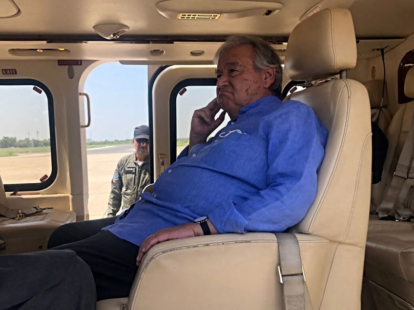 United Nations Secretary-General Antonio Guterres sits in a helicopter during his visit to flood-affected areas in Pakistan's Sindh province on September 10, 2022. - United Nations Secretary-General Antonio Guterres said developing nations were paying a "horrific price" for the world's reliance on fossil fuels, as he toured parts of Pakistan hit by floods blamed on climate change. (Photo by Muhammad DAUD / AFP) (Photo by MUHAMMAD DAUD/AFP via Getty Images)