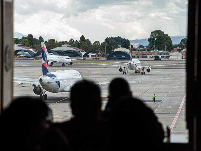 People wait for their departures at Bogota's El Dorado International Airport in Colombia,