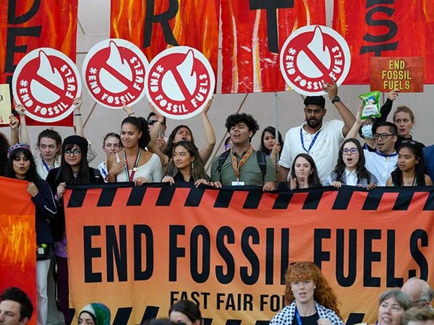 Activists participate in a demonstration against fossil fuels at the COP28 U.N. Climate Summit, Tuesday, Dec. 12, 2023, in Dubai, United Arab Emirates. (AP Photo/Peter Dejong)