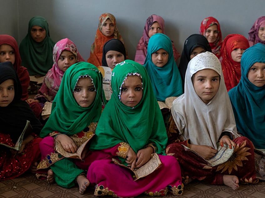 Afghan girls read the Quran in the Noor Mosque outside the city of Kabul, Afghanistan, Wednesday, Aug 3, 2022. Maulvi Bakhtullah, the head of the mosque, said that the number of girls who come to this mosque to learn Quran has multiplied after the closure of public schools. For most teenage girls in Afghanistan, it’s been a year since they set foot in a classroom. With no sign the ruling Taliban will allow them back to school, some girls and parents are trying to find ways to keep education from stalling for a generation of young women. (AP Photo/Ebrahim Noroozi)
