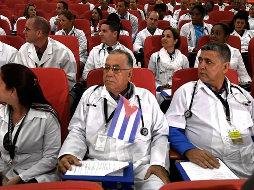 Some 100 Cuban doctors follow proceedings during their induction programme at the Kenya School of Government, on June 11, 2018 in Nairobi. - The doctors will be posted to various hospitals in Kenya's 47 counties. Each county is expected to get at least two doctors. (Photo by SIMON MAINA / AFP) (Photo credit should read SIMON MAINA/AFP/Getty Images)